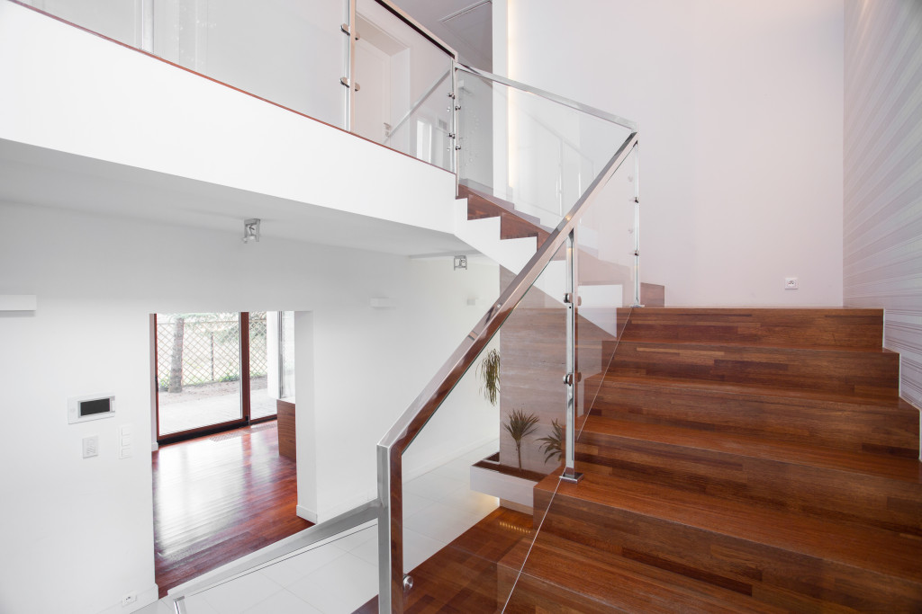 wooden stairs with elegant glass balustrade