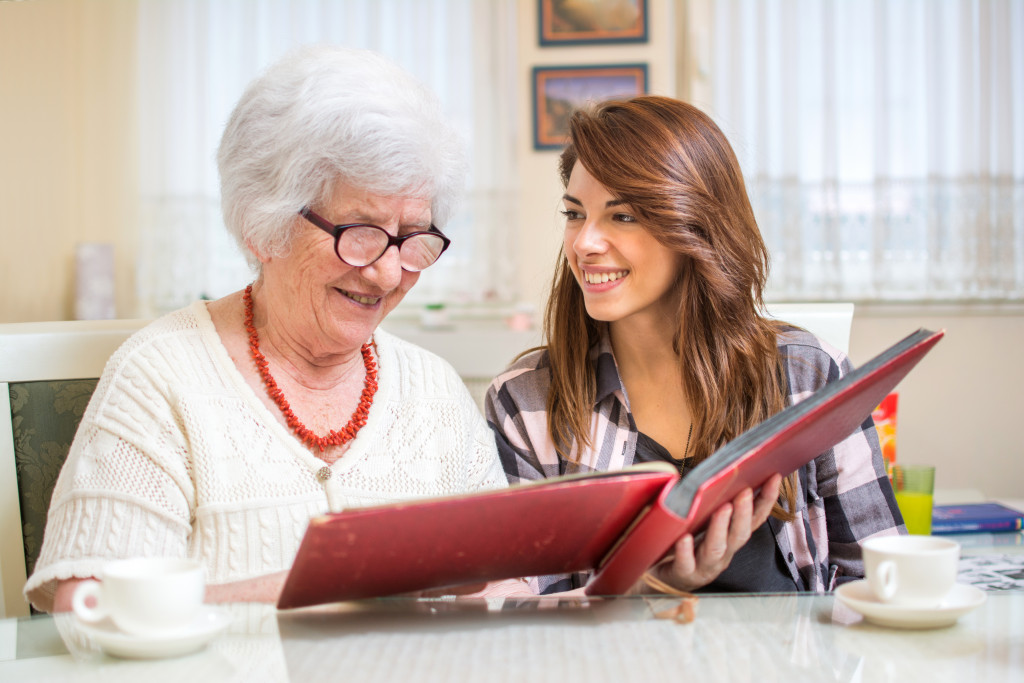 women looking at a photo album