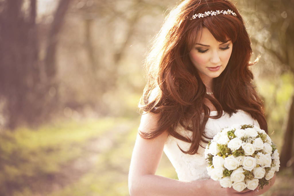 a bride holding a bouquet of flowers