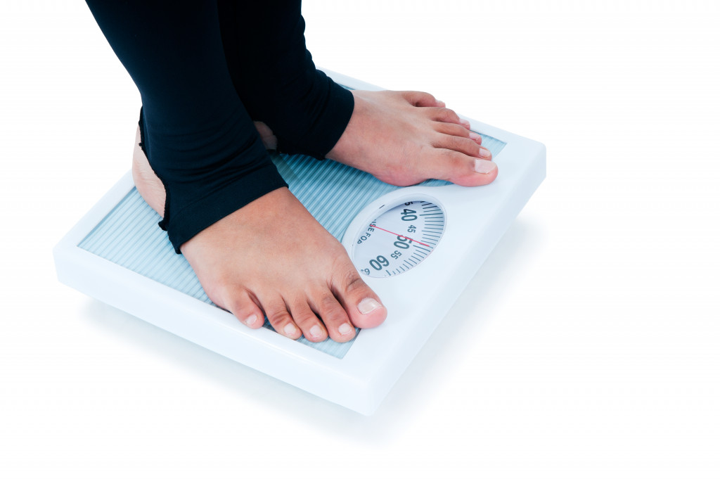 woman weighing herself