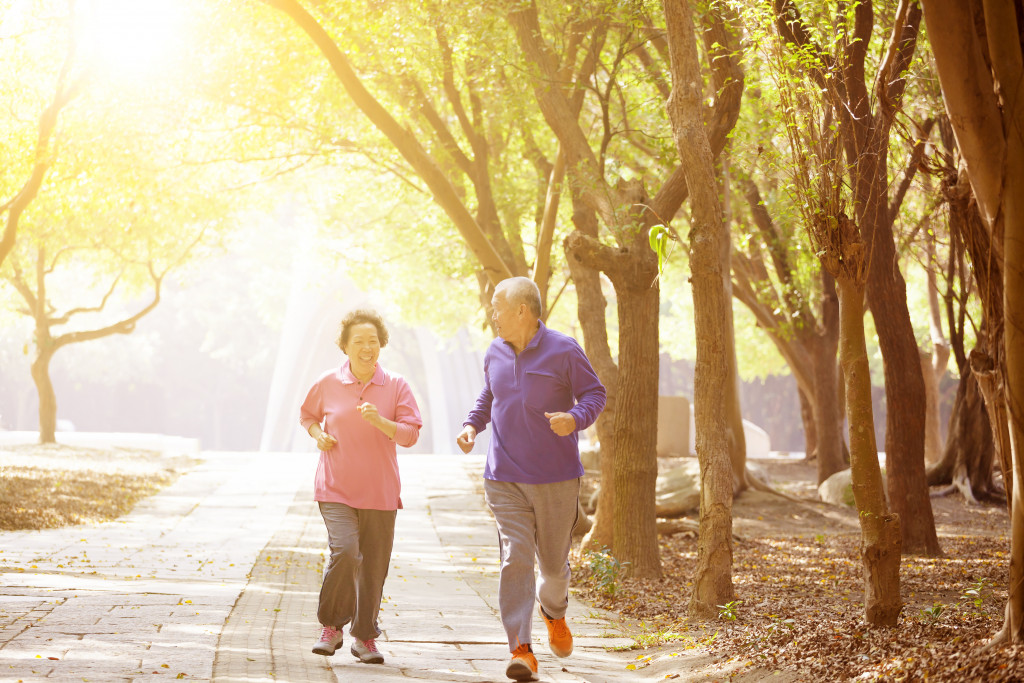 elderly couple jogging