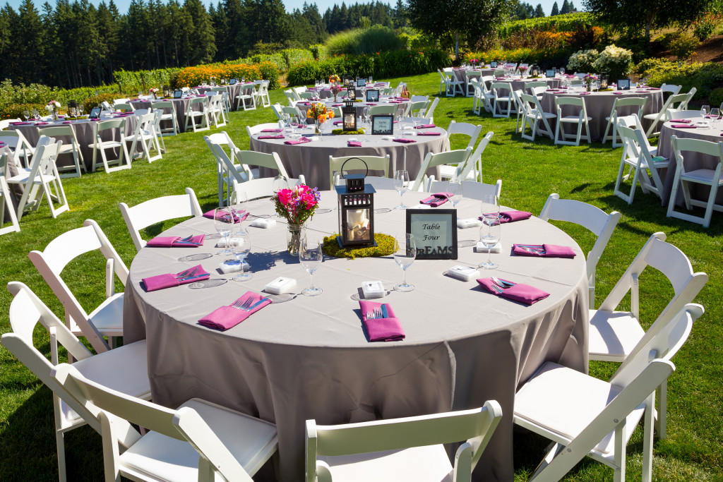 Tables, chairs, decor, and decorations at a wedding reception at an outdoor venue vineyard winery in Oregon