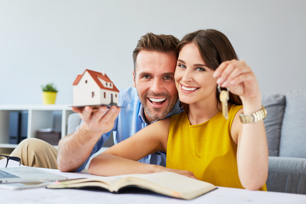 Happy young couple planning to buy a house 