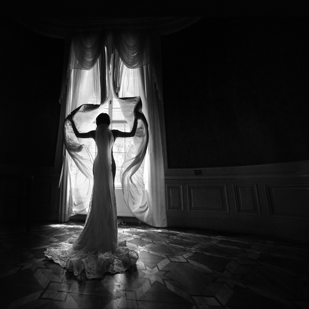 black and white photo of a silhouette of a bride
