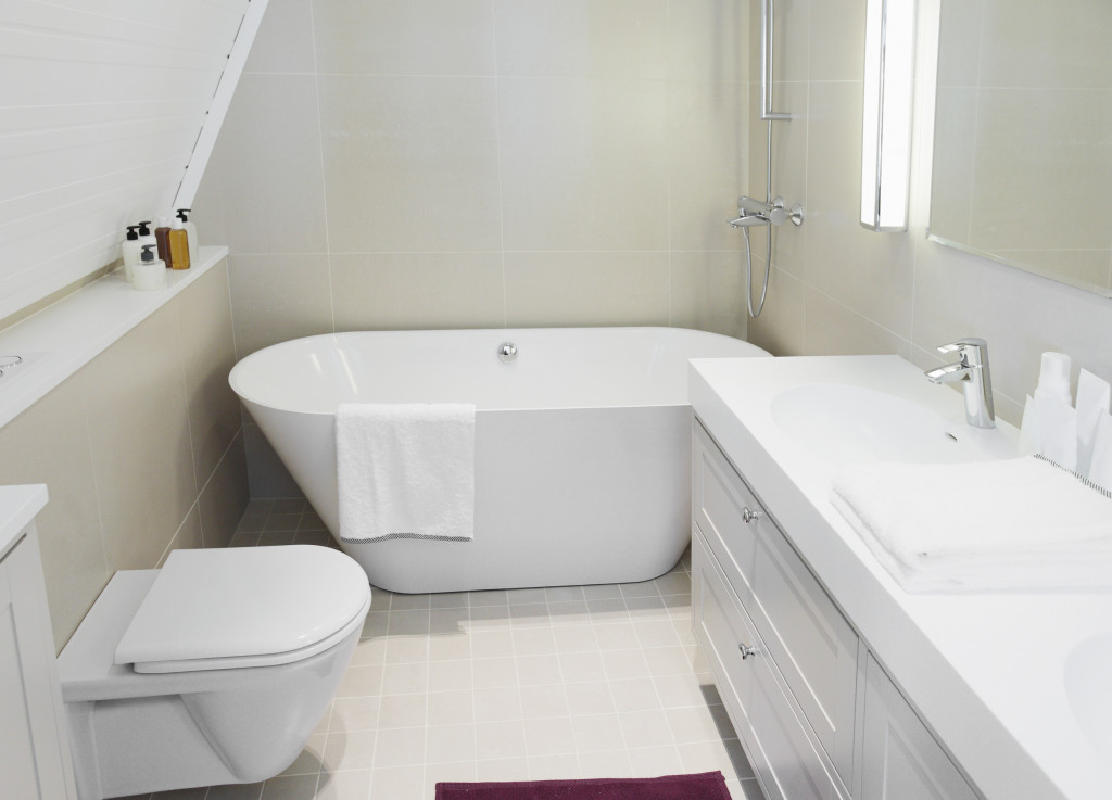 Modern new small bathroom interior with bath tub