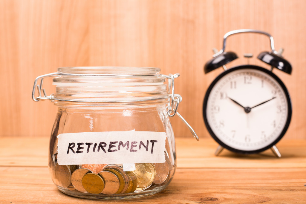 A jar with coins with the word RETIREMENT