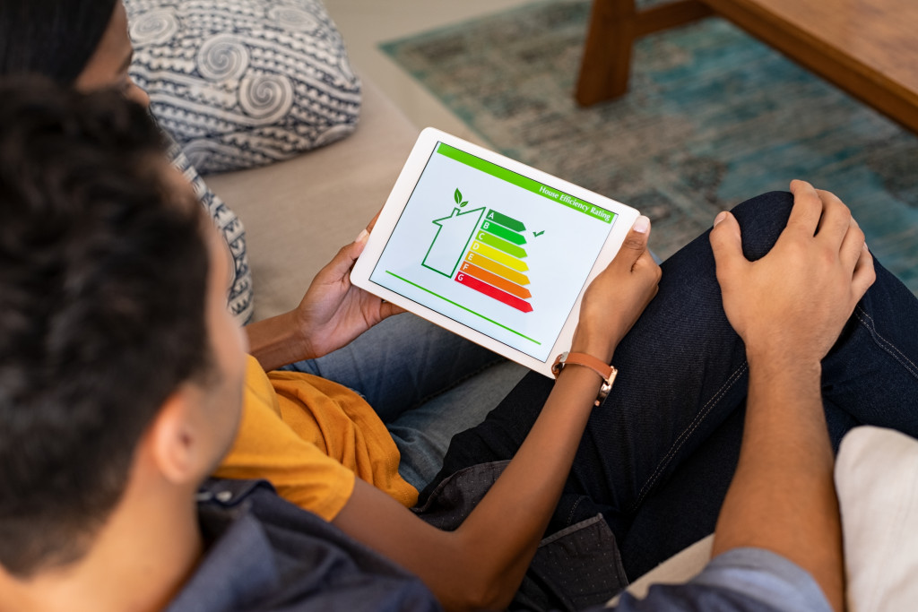 Couple checking the energy efficiency rate of their home.