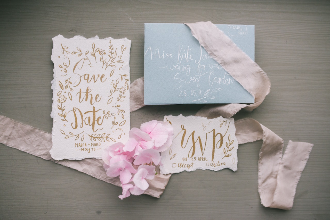save the date wedding invitation on a table