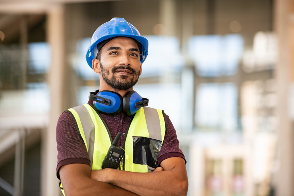 A construction worker posing for the camera